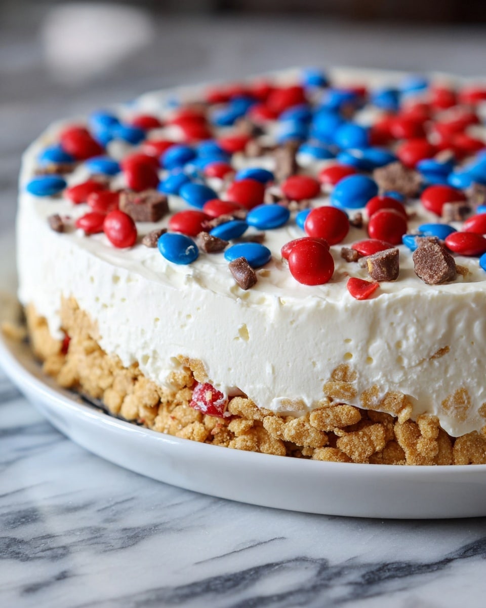 A close-up of a three-layered dessert in a white bowl, set on a white marbled surface. The bottom layer is a crunchy, golden brown cereal base with visible texture. The middle layer is thick and smooth white cream, with soft peaks and a slightly uneven edge. The top layer is decorated with scattered red and blue candy-coated chocolate pieces, adding a colorful contrast on the white cream. Photo taken with an iphone --ar 4:5 --v 7