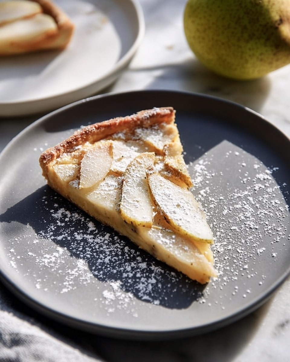 A slice of light golden tart with a thin crust sits on a white plate, topped with three thin slices of caramelized pear arranged vertically. The tart's surface is dusted with white powdered sugar, creating a soft, snowy effect around the fruit. The crust edges are slightly uneven and browned. The plate rests on a gray cloth with part of a pear blurred in the background on a white marbled surface. photo taken with an iphone --ar 4:5 --v 7