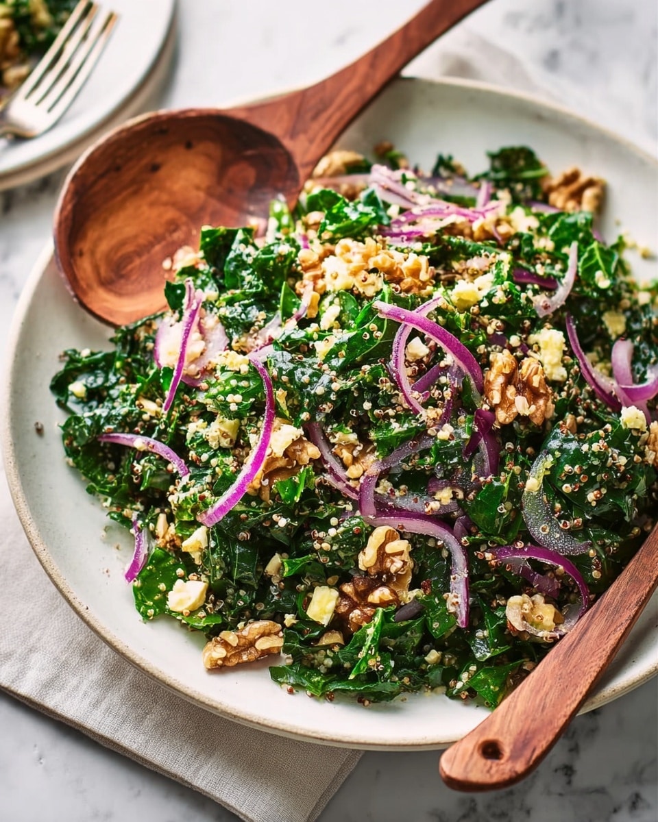 A white shallow bowl holds a fresh salad with several layers: at the base, dark green chopped leafy greens mix with light beige quinoa grains scattered throughout. Thin, curved slices of purple onion are spread evenly on top, adding a bright contrast. Small broken pieces of walnut with light brown shells and creamy centers are sprinkled across the salad. Tiny bits of white cheese are visible among the greens and nuts. Wooden salad spoons rest on the edge of the bowl, and the bowl itself is placed on a white marbled surface. Photo taken with an iphone --ar 4:5 --v 7