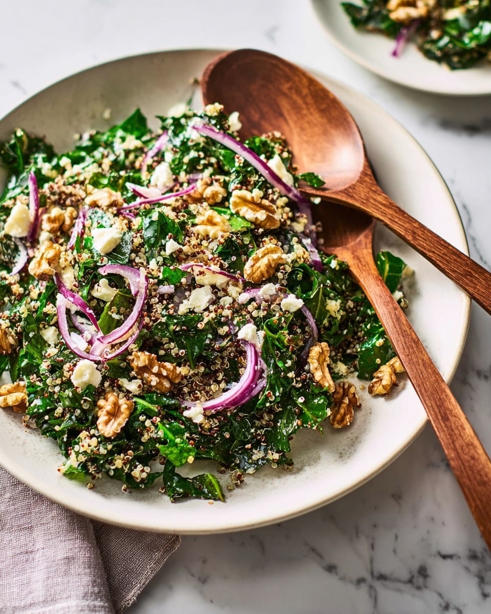 A white shallow dish filled with a fresh salad showing three main layers: chopped dark green leafy vegetables at the base, thinly sliced purple onions layered on top mixed evenly, and small pieces of light brown walnuts scattered throughout. There are also small bits of light yellow cheese and tiny beige quinoa grains spread across the salad. A wooden spoon and fork rest on the edge of the plate, and the background shows a white marbled texture surface. photo taken with an iphone --ar 4:5 --v 7