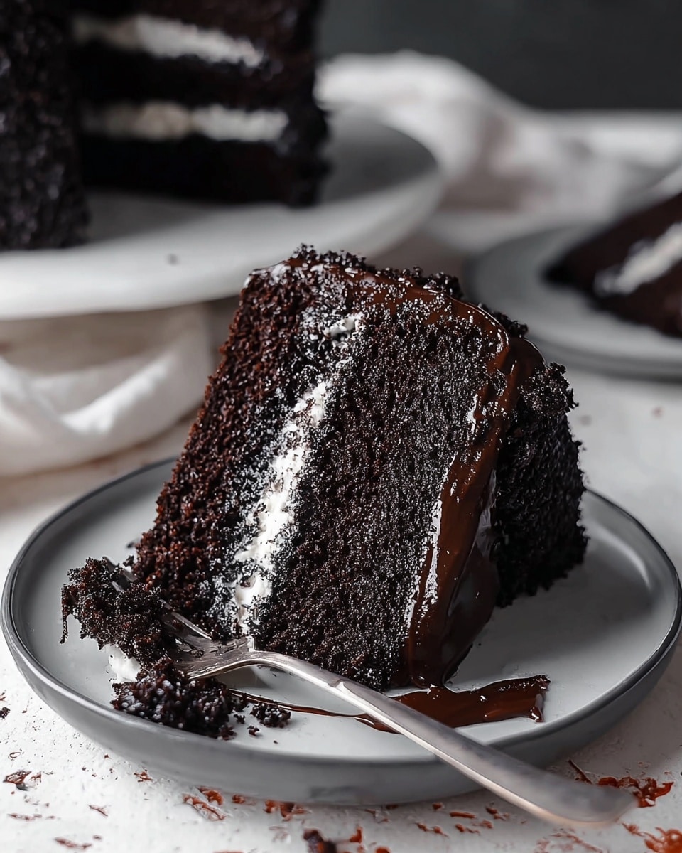 A tall slice of dark chocolate cake is shown with three layers: the top and bottom layers are rich, crumbly chocolate cake in deep black color, and the middle layer is a thick, smooth white cream. The entire slice is covered with shiny dark chocolate glaze with textured chocolate crumbs on the top and sides. The slice sits on a white plate with a silver fork beside it, with some crumbs scattered around. The background is a white marbled texture with soft lighting highlighting the cake’s moist and glossy appearance. Photo taken with an iphone --ar 4:5 --v 7