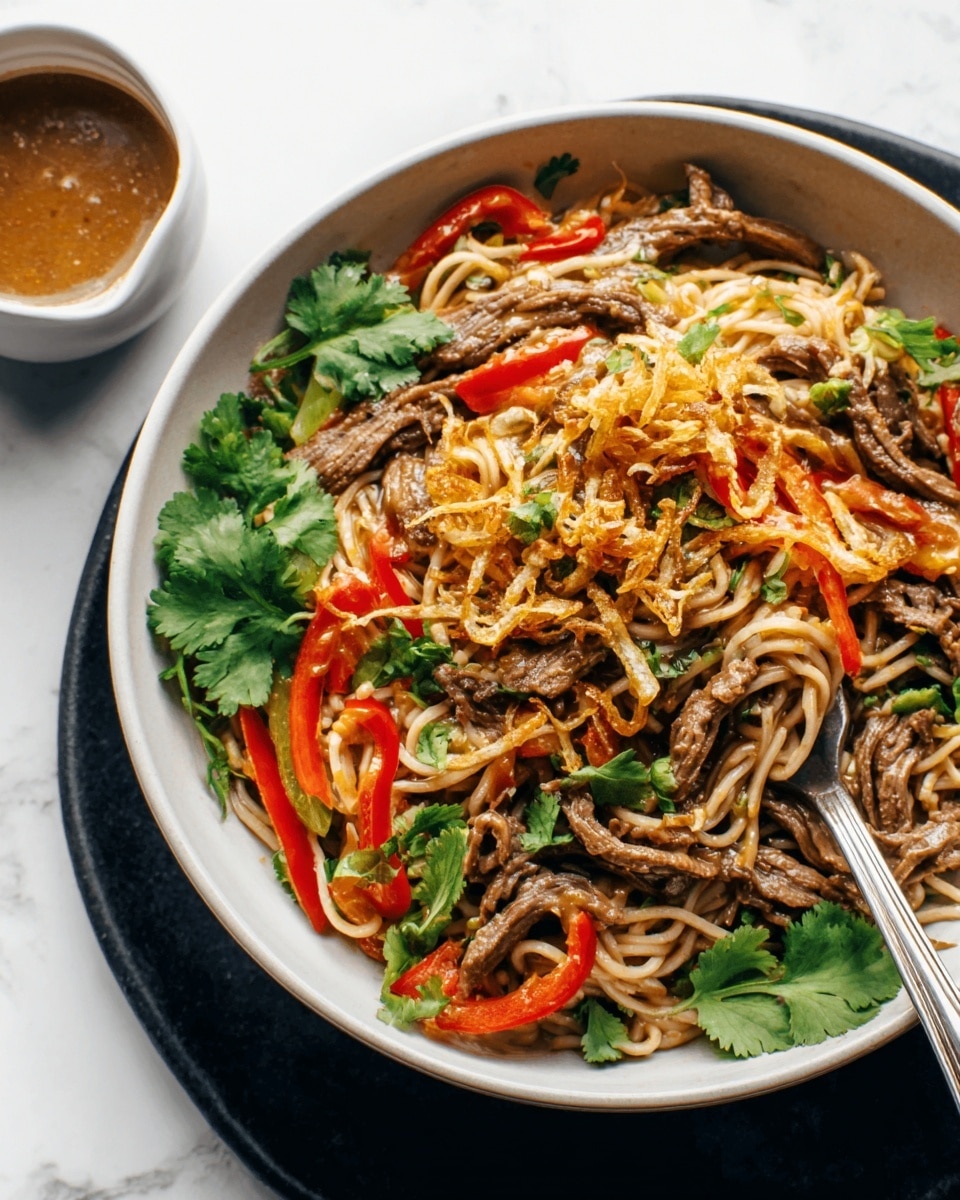 A close-up of a white bowl filled with a layered noodle dish. The bottom layer has dark brown noodles mixed with thin strips of red chili and green herbs. On top, there is a creamy, light brown sauce coating the noodles, with small pieces of crushed peanuts scattered over it. A silver spoon rests inside the bowl on the right. Fresh green cilantro leaves decorate the edges of the bowl, which sits on a white marbled surface with a small cup of brown sauce next to it. Photo taken with an iphone --ar 4:5 --v 7