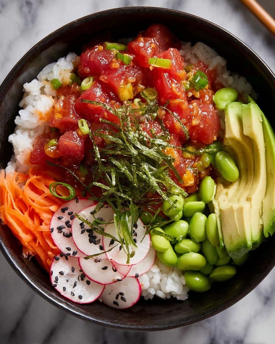 The image shows a bowl with four main layers: at the bottom, there is a bed of white rice with a soft texture; on top of the rice, to one side, there are bright red small cubes of raw tuna mixed with a dark red sauce and small green cucumber pieces scattered on it; next to the tuna, there are thinly sliced pale pink radishes with some black sesame seeds sprinkled over them; on the opposite side, there are bright green edamame beans placed beside long, thin bright orange carrot strips, and sliced light green avocado fanned out with a drizzle of a shiny brown sauce, garnished with thin green seaweed strips. The bowl is white, with the food sitting on a white marbled surface. photo taken with an iphone --ar 4:5 --v 7